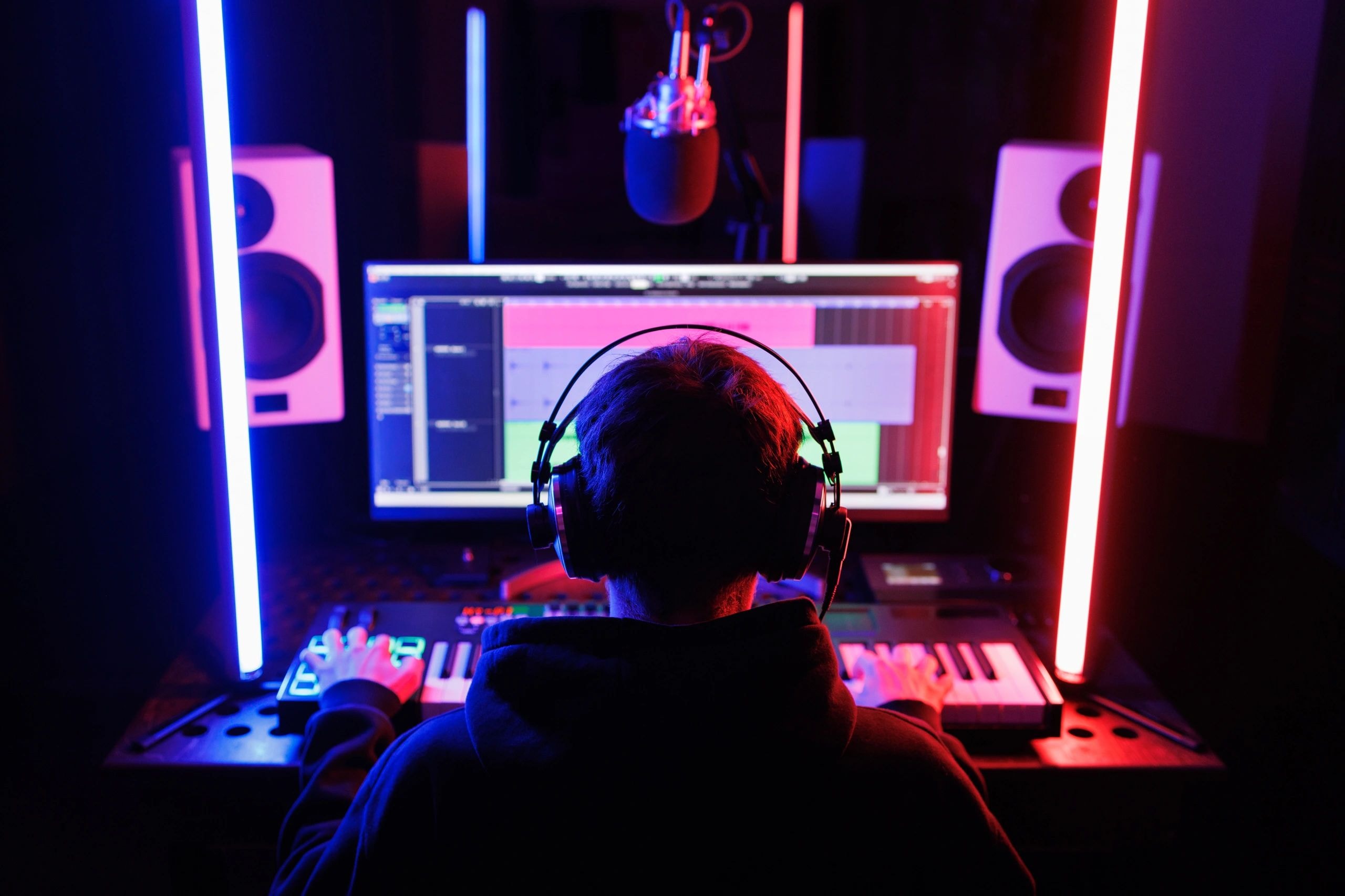 Studio Recording — music producer at neon-lit setup